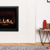 Rinnai 650 (600mm) Gas Fire Pebble Stones - Matte Black Frame Insitu Wall Family Room