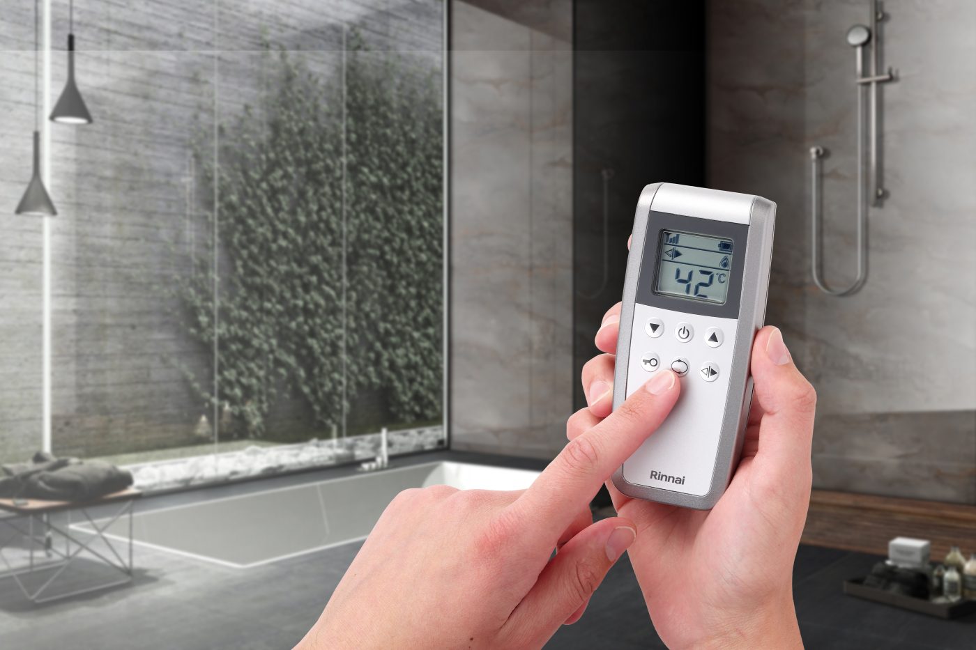 Rinnai Wireless Hot Water Controller (in hand in bathroom)