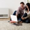Rinnai Energysaver Heaters 559FDT (Commercial) Lifestyle Family Room couple in front of laptop