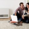 Rinnai Energysaver Heaters 559FDT (Commercial) Lifestyle Family Room couple in front of laptop
