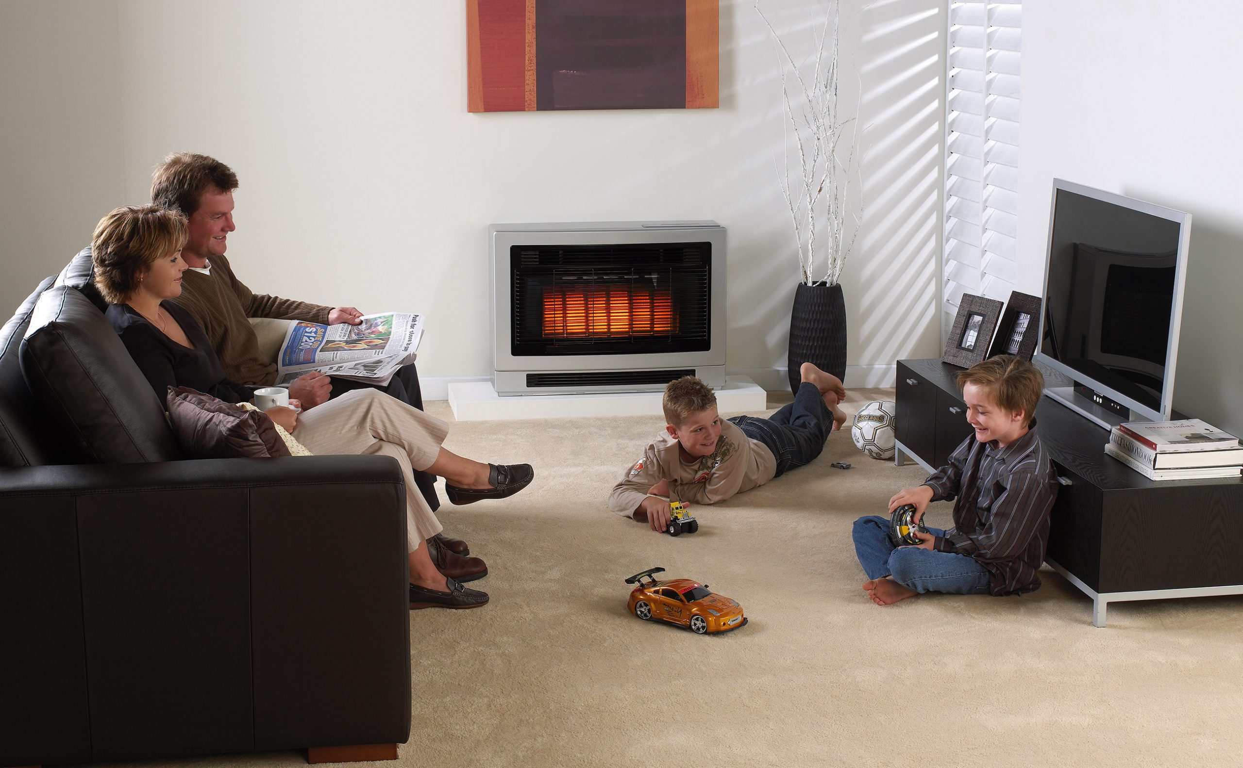 Rinnai Ultima II Console Gas Flued Space Heater (lifestyle - silver family living room)