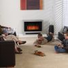 Rinnai Ultima II Console Gas Flued Heater Silver Angle Right 2 Lifestyle Insitu Family Room parents and kids children